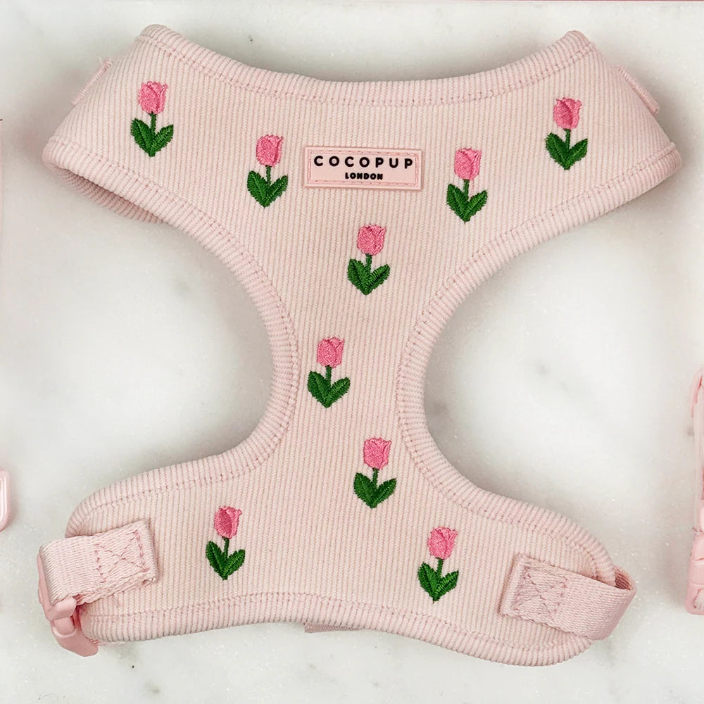 Cocopup London adjustable dog harness in light pink with embroidered   pink tulips. Pink tulip. D ring for lead attachment,
Luxe Cord Material with embroidered Tulips,
Lightweight and comfortable,
Fully adjustable chest strap. Tulip Tails collection.