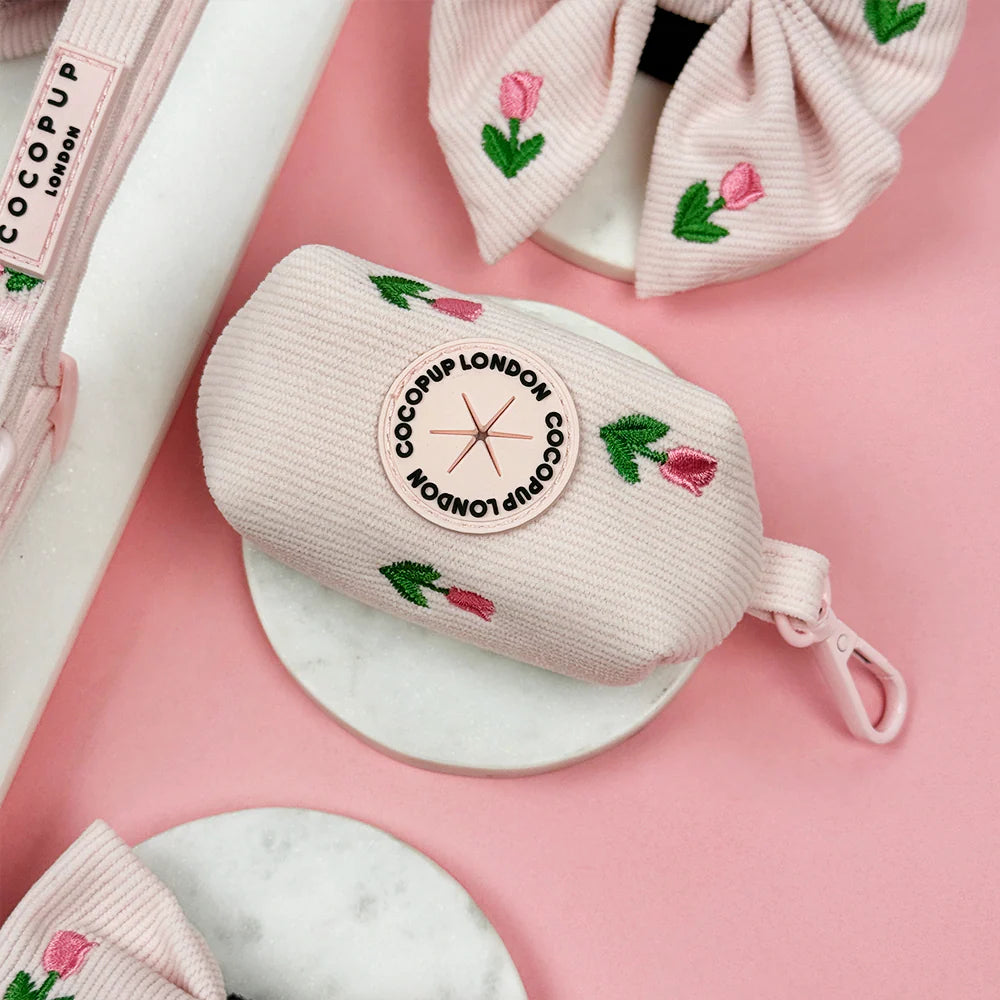 Cocopup London dog poop bag in light  pink with embroidered pink tulips. pink tulip. Tulip Tails collection.