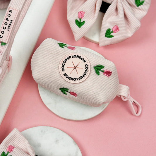 Cocopup London dog poop bag in light  pink with embroidered pink tulips. pink tulip. Tulip Tails collection.